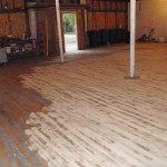 Inserting the repurposed maple flooring